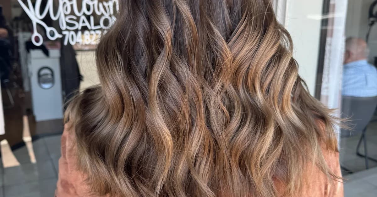 Brunette caramel balayage with lived-in color on long hair by Brooke Holland independent hairstylist